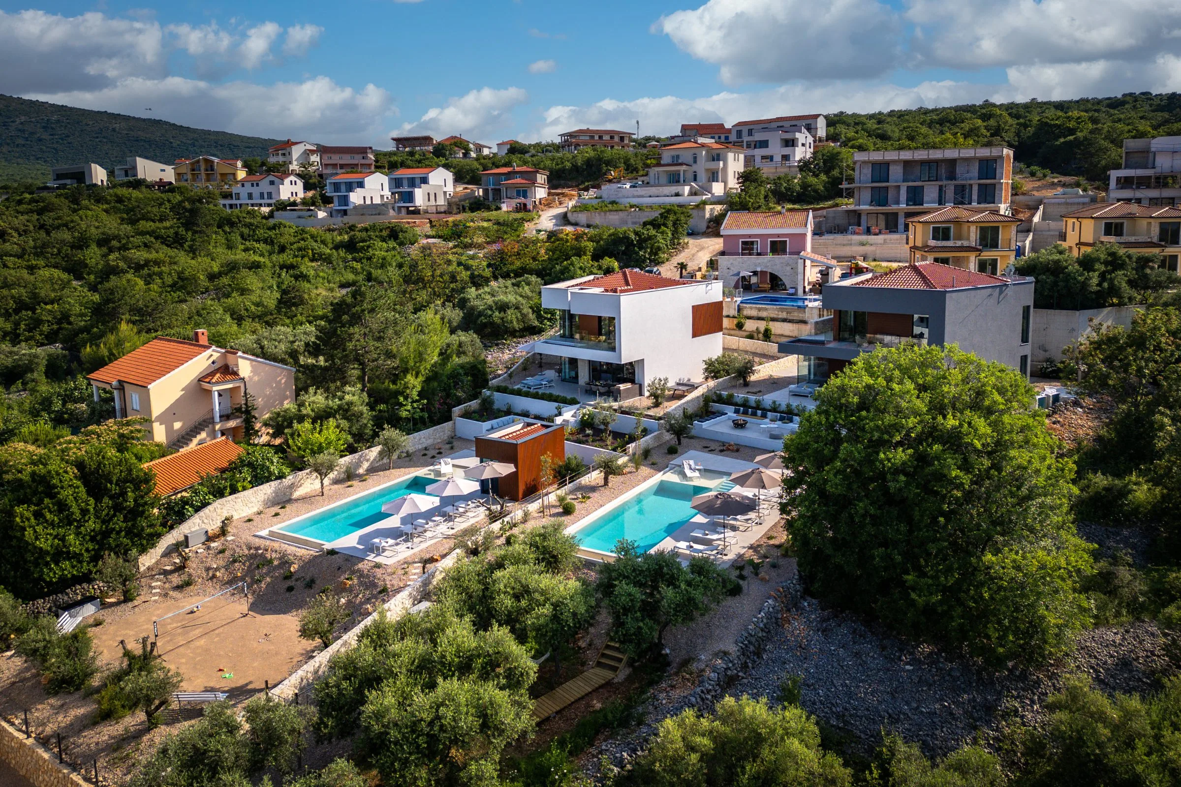 Aerial view of the estate — both villas, two pools, olive grove, Kvarner Bay