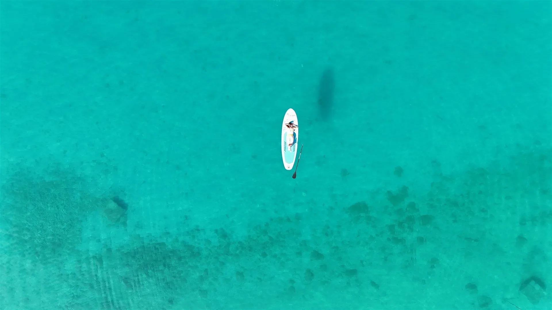 Stand up paddleboarding on crystal-clear Adriatic water near Villa Marim, Stara Baška